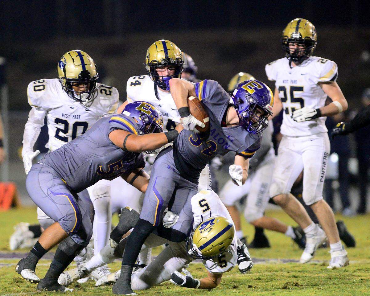 Escalon running back Talan Reider (32) fights for extra yards during a 2023 CIF San Joaquin Section Division IV football game between Escalon and West Park at Escalon High School in Escalon, California, on Nov. 17, 2023. Escalon won the game 48-28.
