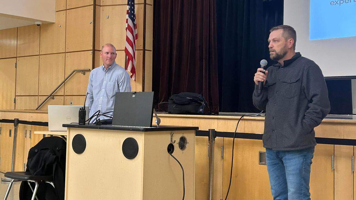 Mitch Watson, left, and Ryan Daley speak to a crowd of Modesto Youth Soccer Association members at Enochs High School on Dec. 19, 2024 regarding the termination of Watson — who’s accused of mismanaging funds.