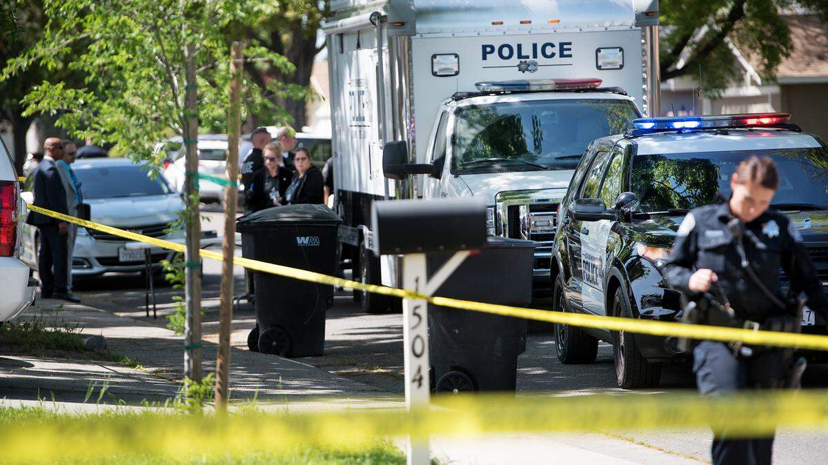 Modesto police investigate the scene on Coffee Villa Drive in Modesto, Calif., where Shannon Simpson was found murdered in her home April 3, 2018.