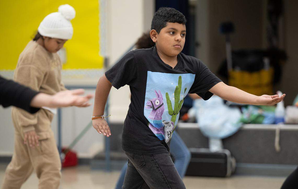 Fourth-grade student Sergio Paniajua and his schoolmates practice tai chi at Orville Wright Elementary School in Modesto on Thursday, March, 13, 2025.