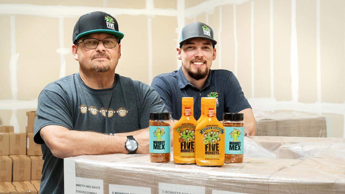 Five Monkeys barbecue sauce owners George Morasci and his son Nico Morasci, right, at their warehouse in Ceres, Calif., Thursday, August 3, 2023.