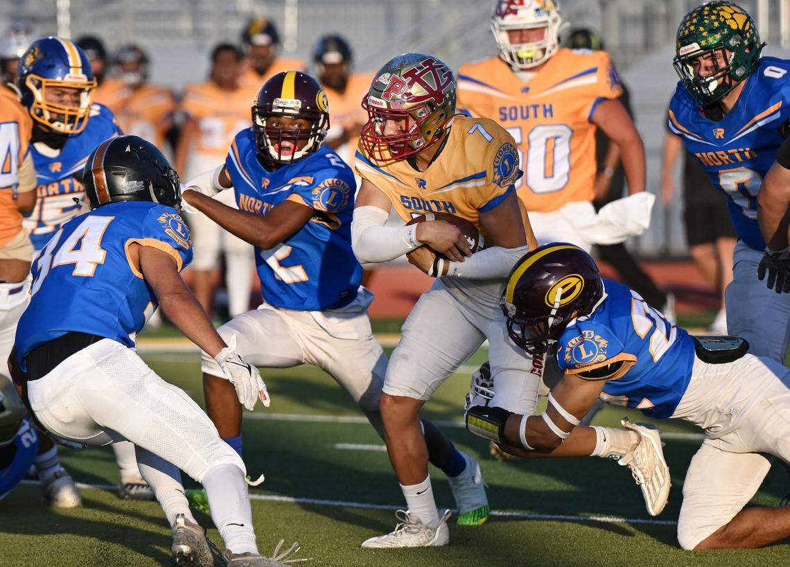 South team quarterback Eleazar Garcia (Golden Valley) runs the ball during the Central California Lions All-Star Football Game at Tracy High School in Tracy, Calif., Saturday, June 24, 2023. The South won the game 38-13.