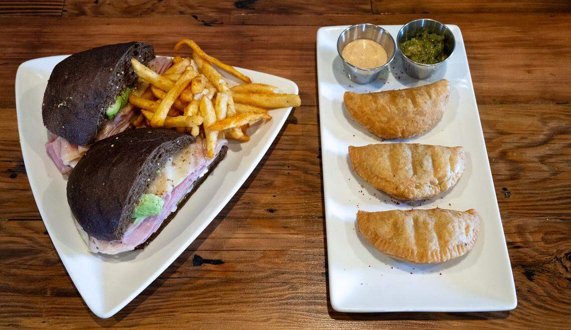 Bavarian ham sandwich with grilled chicken empanadas at Cora restaurant at Roseburg Square in Modesto, Calif., Friday, May 24, 2024.