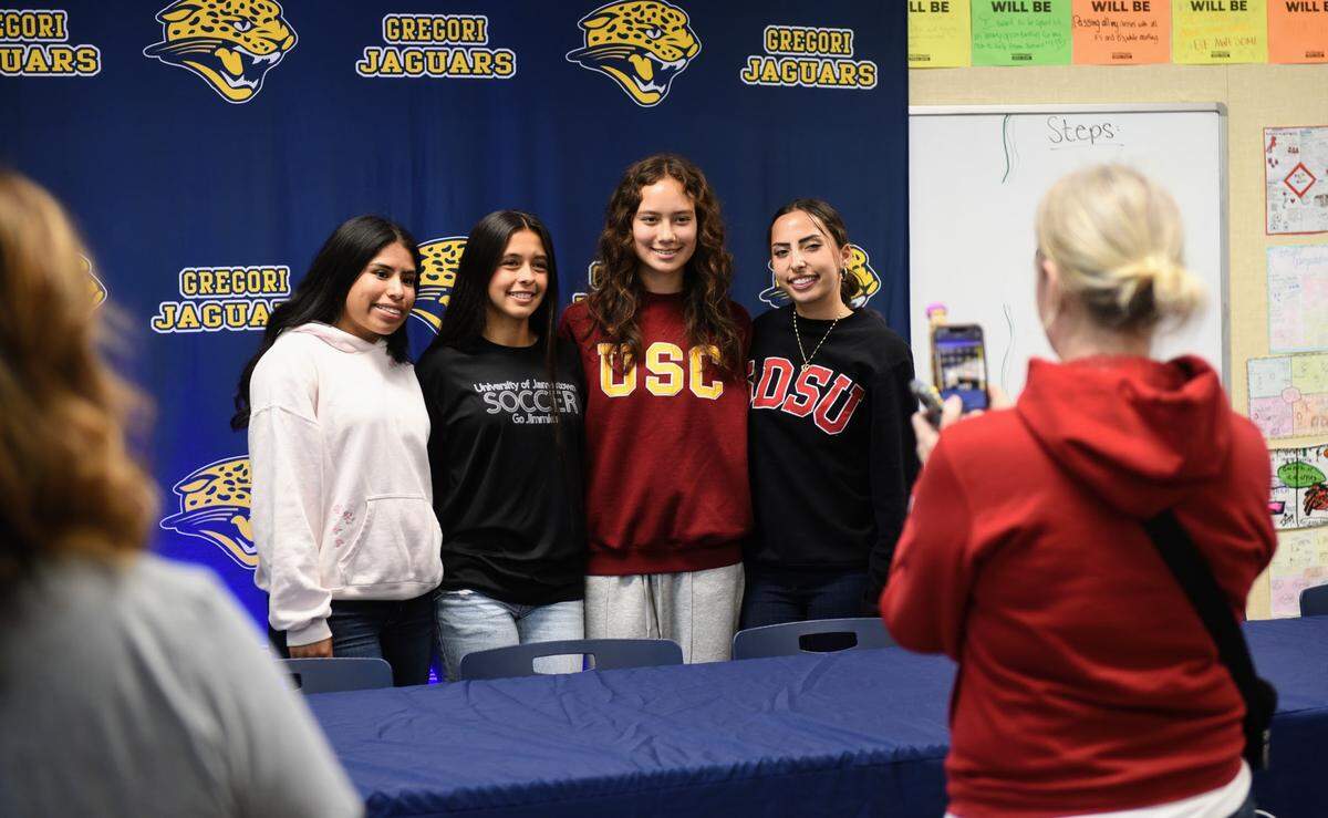 Gregori girls soccer players Julliet Lopez (University of Jamestown signee) and Alison Hou (USC signee) take a picture with friends at the Gregori High class of 2025 college athlete ceremony at Gregori High School on Thursday, April 24, 2025.