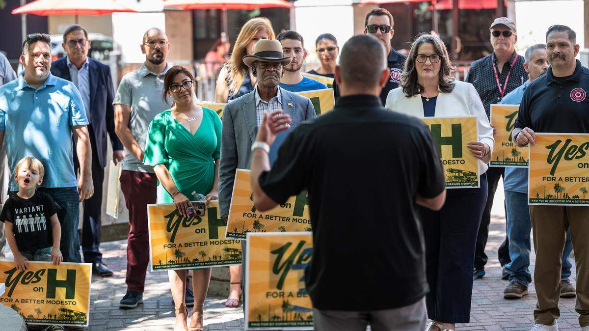 Supporters of Measure H listen to Johnny Garcia, president of the Central Valley Hispanic Chamber of Commerce, during a campaign kickoff rally in Modesto, Calif., on Thursday, September 1, 2022.