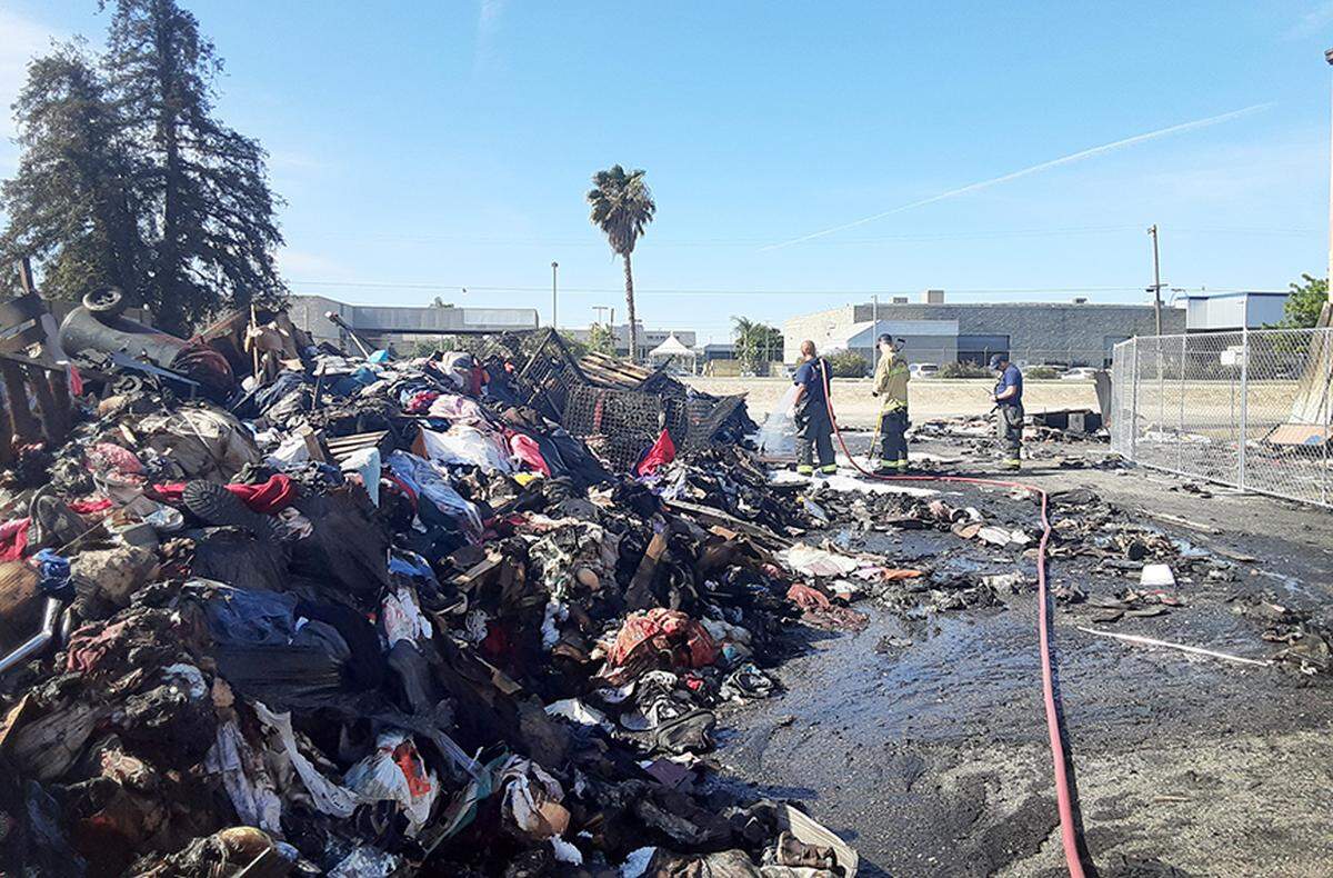 Firefighters continue mop up work Friday morning from Thursday’s fire at The Salvation Army Family Thrift Store and Donation Center on north McHenry Avenue in Modesto. The fire was in the warehouse and its cause is under investigation.