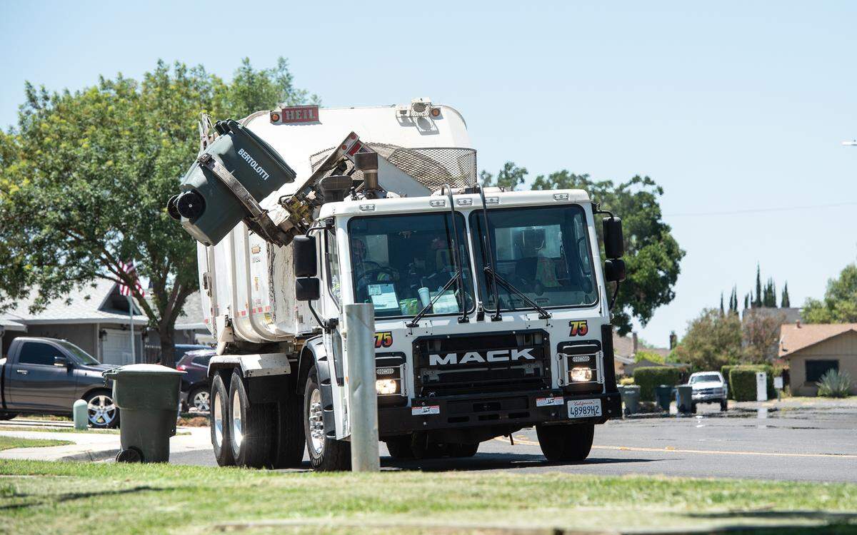 A Bertolotti disposal truck collects garbage in Ceres, Calif., on Tuesday, June 22, 2021.