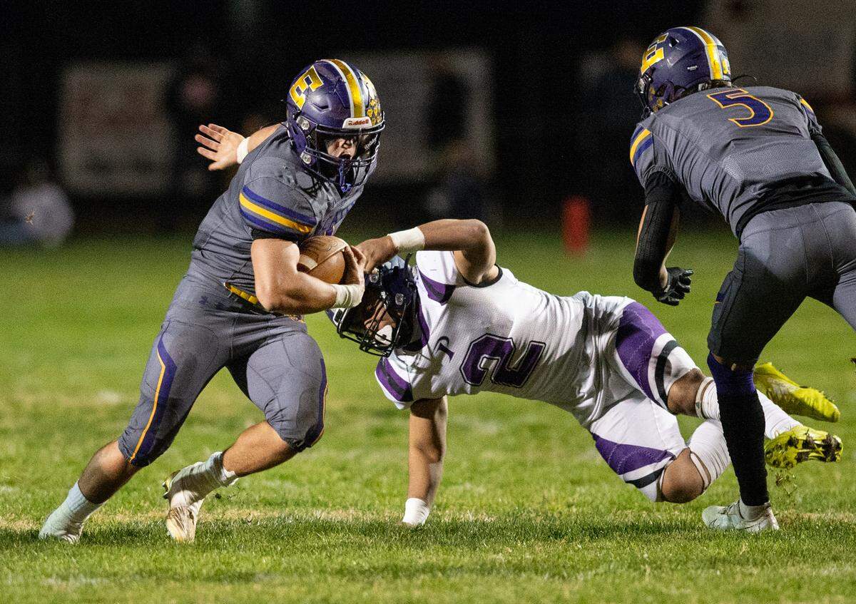 Escalon’s Ryker Peters runs the ball during the first round playoff game with Pacheco in Escalon, Calif., Friday, Nov. 4, 2022.