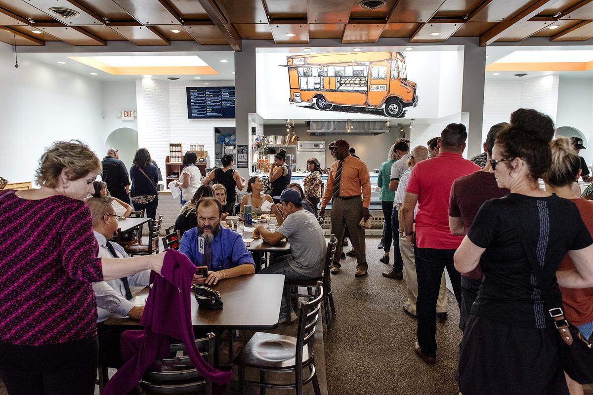Patrons line up for lunch at Food Fix Butcher & Baker restaurant in Modesto, Calif., Thursday, Aug. 22, 2019.