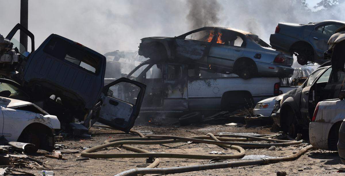 Vehicles burn at an auto salvage yard on Crows Landing Road in south Modesto on Sunday afternoon, May 29, 2022.