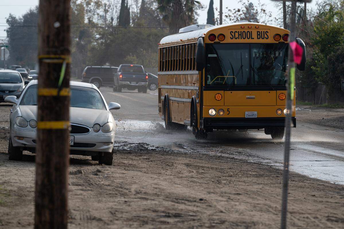 A school bus drives along Dallas Street in Modesto, Calif., Thursday, Dec. 8, 2022. 