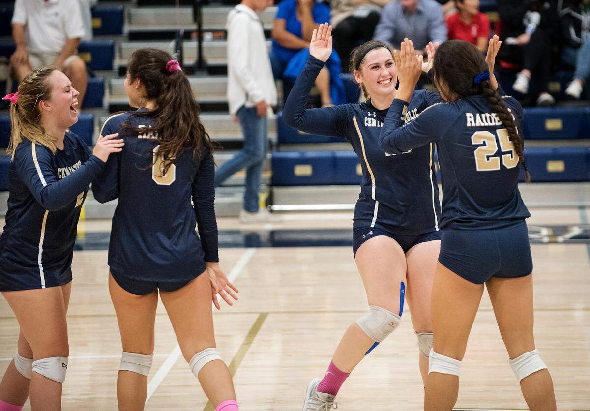 Central Catholic’s Cameron Sauls (10) celebrates with teammate Abby Castillon (25) during the Valley Oak League match with Manteca at Central Catholic High School in Modesto, Calif., on Thursday, Oct. 4, 2018.