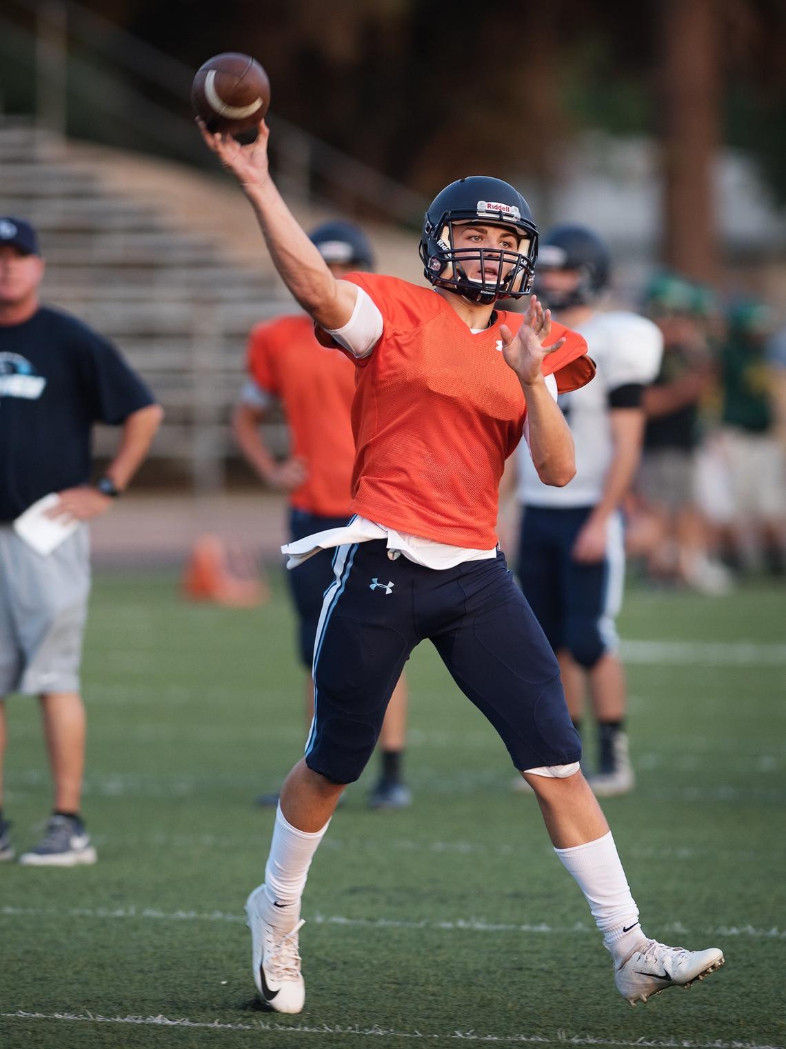 Downey quarterback Beau Green makes a pass during a preseason scrimmage at Downey High School in Modesto, Calif., Friday, August 10, 2018. 