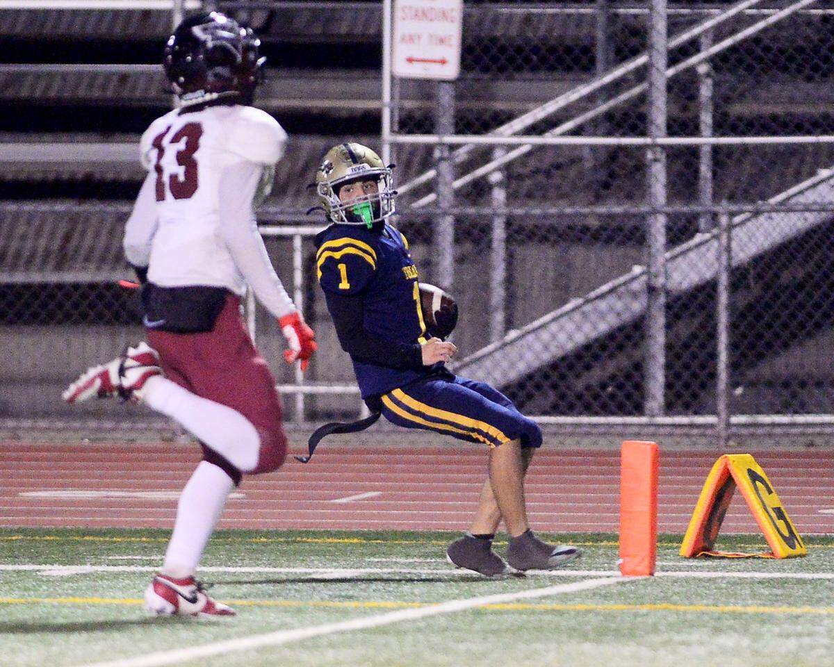 Turlock receiver Junior Silva (1) runs into the end zone to score a touchdown during a Division 1 CIF San-Joaquin Section playoff game between Turlock High School and Laguna Creek High School at Turlock High School in Turlock California on November 8, 2024. Turlock won the game 48-12.