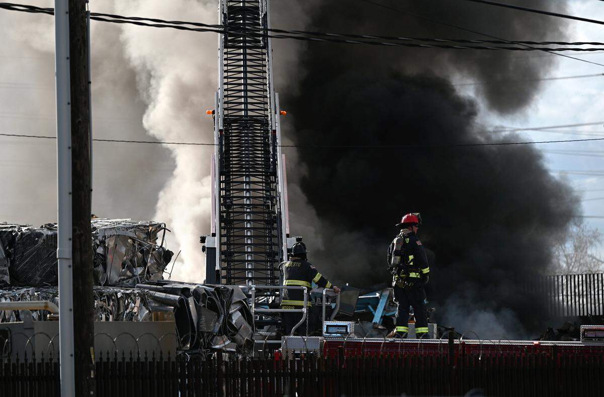 A fire at Modesto Junk Company recycling on 9th Street called for several fire engine and truck companies for containment in Modesto, Calif., Tuesday, March 7, 2023.