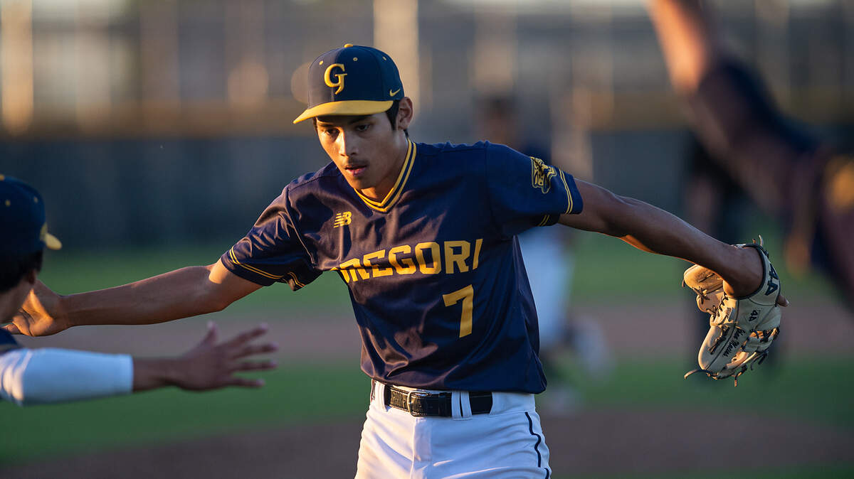 Gregori pitcher Paul Gutierrez Contreras comes off the field after closing out the Central California Athletic League game at Enochs High School in Modesto on March 23, 2022. Gregori won the game 8-6 in extra innings.