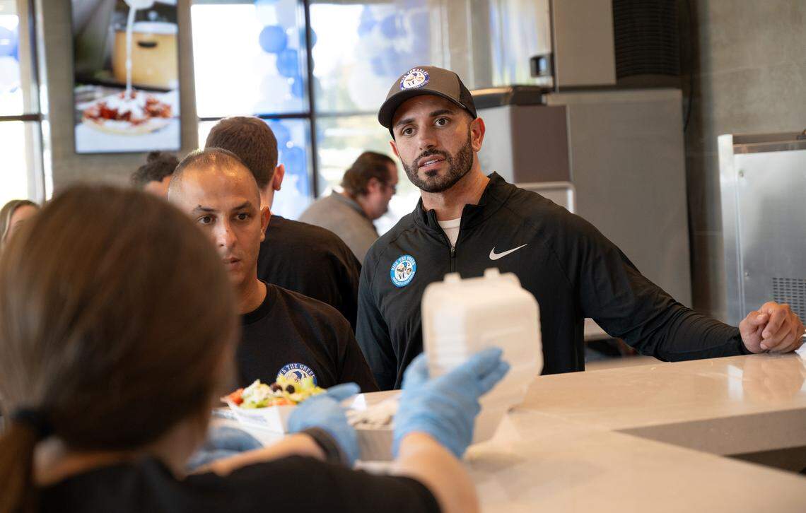 Franchise owner Jerry Ajlouny, right, talks with servers at Nick the Greek restaurant in Riverbank, Calif., Tuesday, September 12, 2023.
