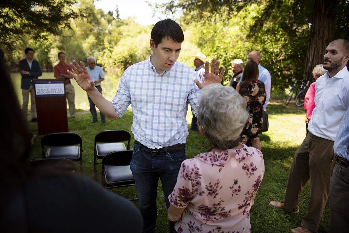 Congressman Josh Harder talks with Modesto City Council member Jenny Kenoyer before he announces a new water bill at Tuolumne River Regional Park in Modesto, Calif., Wednesday, April 24, 2019.