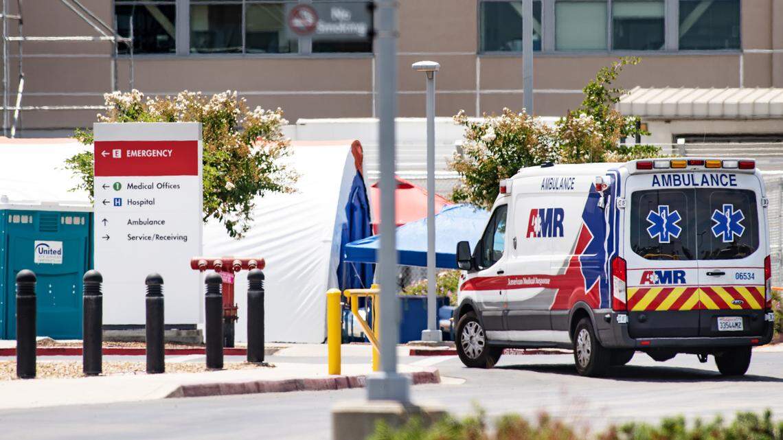 An ambulance pulls into the emergency department at Kaiser Medical Center in Modesto, Calif., on Tuesday, July 21, 2020.