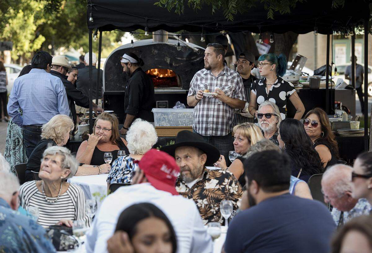 People dine during the 2016 Edible Extravaganza, held then at Modesto Centre Plaza.