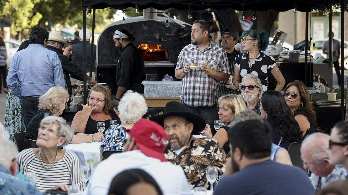 People dine during the 2016 Edible Extravaganza, held then at Modesto Centre Plaza.