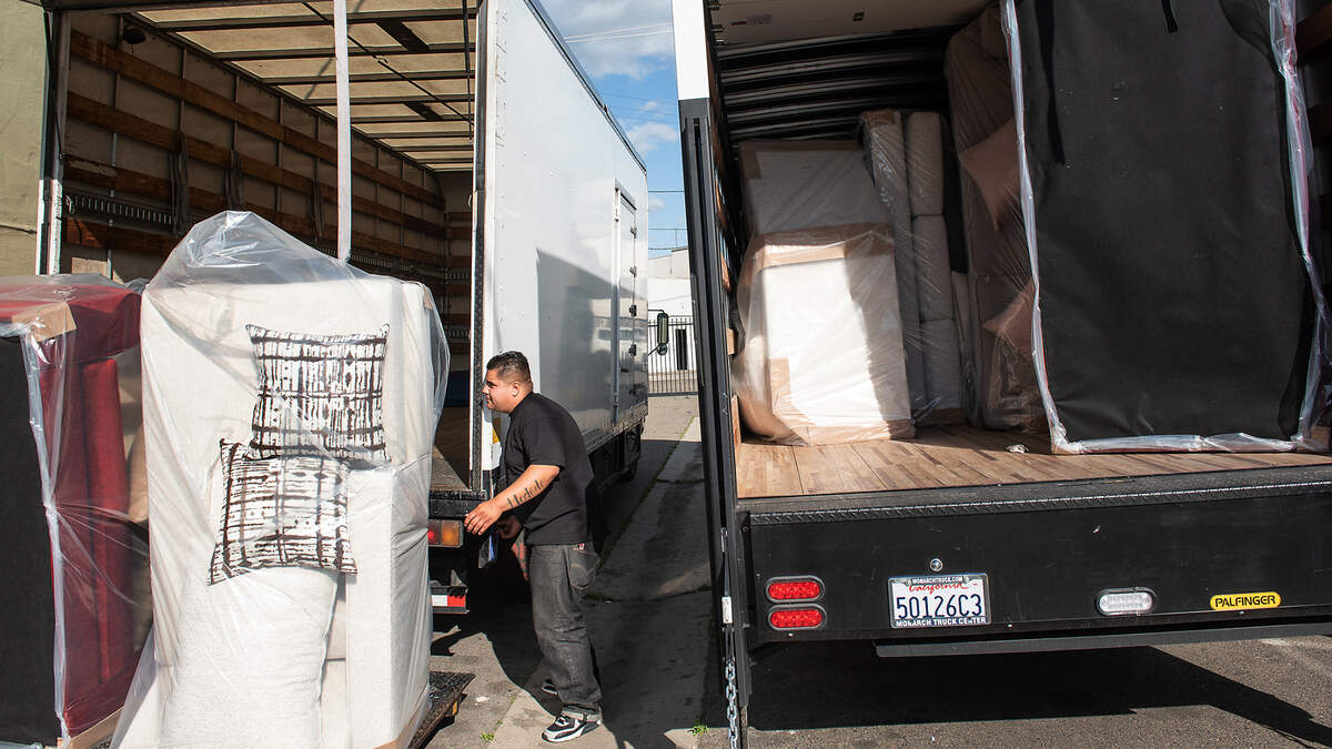 Driver Jonathan Cabebe loads couches for delivery at Minerva’s Furniture Gallery in Turlock, Calif., on Thursday, March 25, 2021. Businesses in Turlock are set to begin collecting the Measure A sales tax on April 1, five months after residents passed it with 56.7% of the vote.