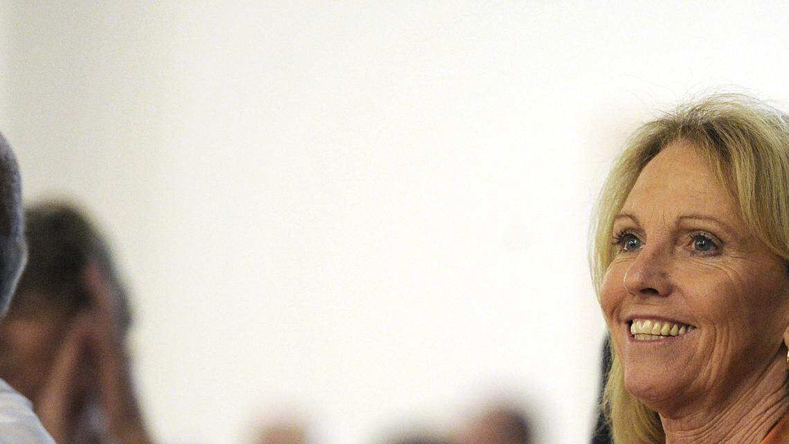 Janice Wilkerson, who heads the volunteer program at Mercy Medical Center, applauds during the Service Awards Luncheon Thursday afternoon (05-29-14) at St. Patrick's Church in Merced.