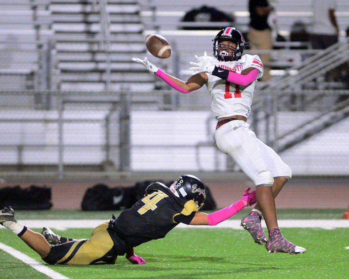 Modesto receiver Zavionn Khaleck (11) reaches back for a ball during a game between Modesto High School and Enochs High School at Gregori High School in Modesto, CA on October 4, 2024.