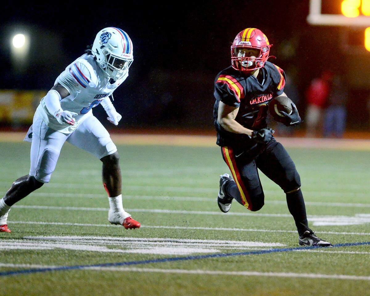 Oakdales Richard Flores (2) runs a sweep during a 2024 CIF Sac-Joaquin Section Division 3 playoff game between Oakdale High School and Destiny Christian Academy at Oakdale High School in Oakdale California on November 22, 2024. Oakdale won the game 49-35.