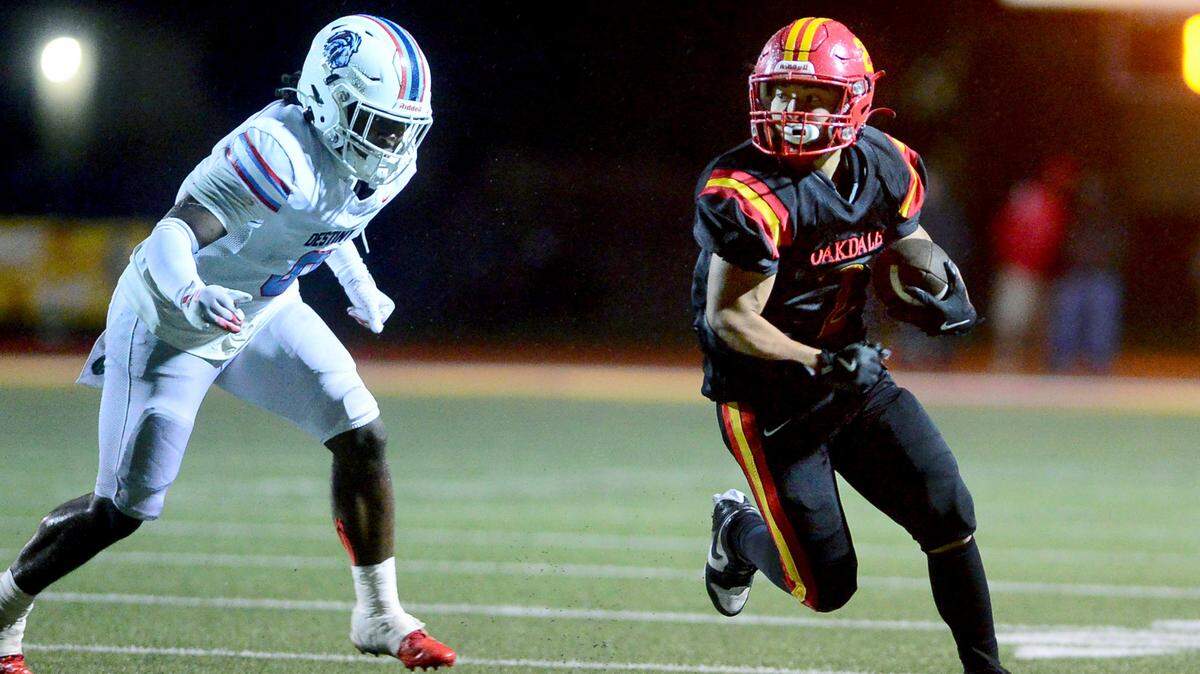 Oakdales Richard Flores (2) runs a sweep during a 2024 CIF Sac-Joaquin Section Division 3 playoff game between Oakdale High School and Destiny Christian Academy at Oakdale High School in Oakdale California on November 22, 2024. Oakdale won the game 49-35.