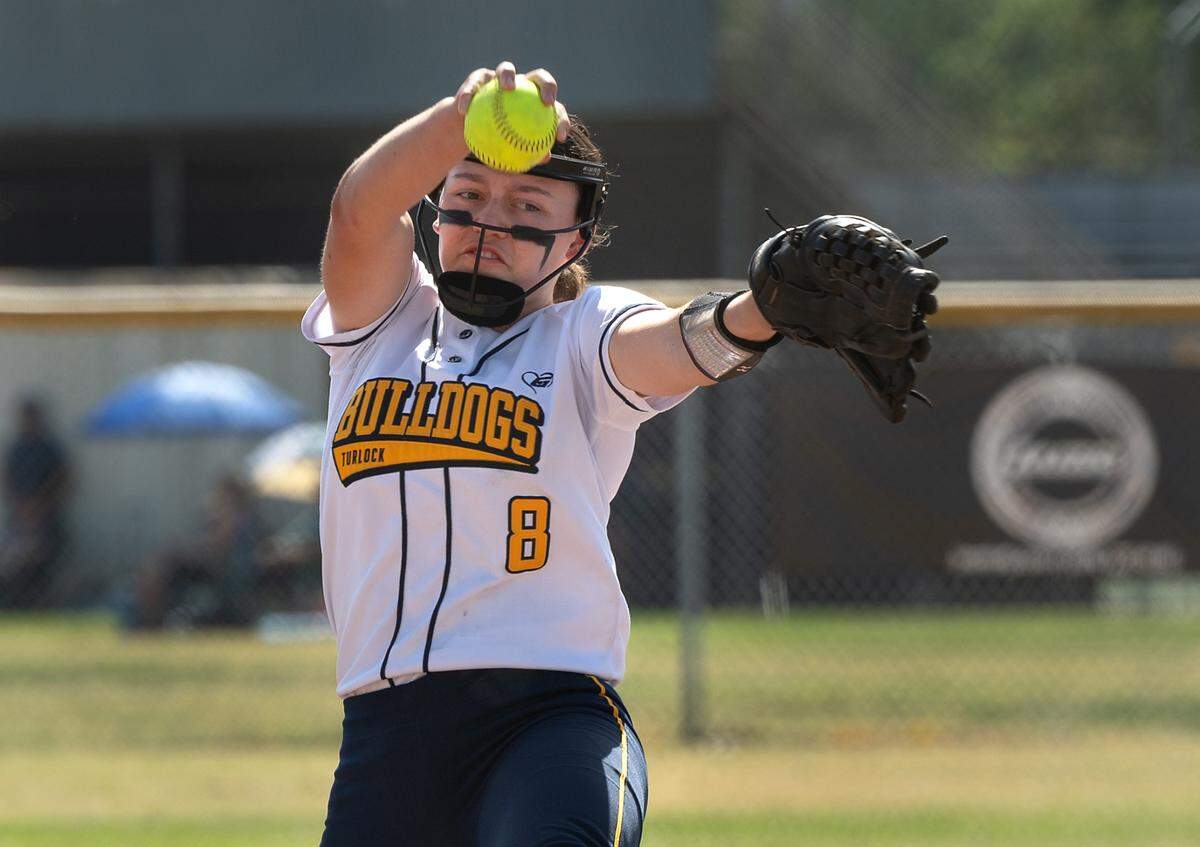 Turlock’s Abbey Harrington delivers a pitch during the Central California Athletic League game with Pitman at Turlock High School in Turlock, Calif., on Thursday, April 7, 2022. Turlock won the game 8-2.