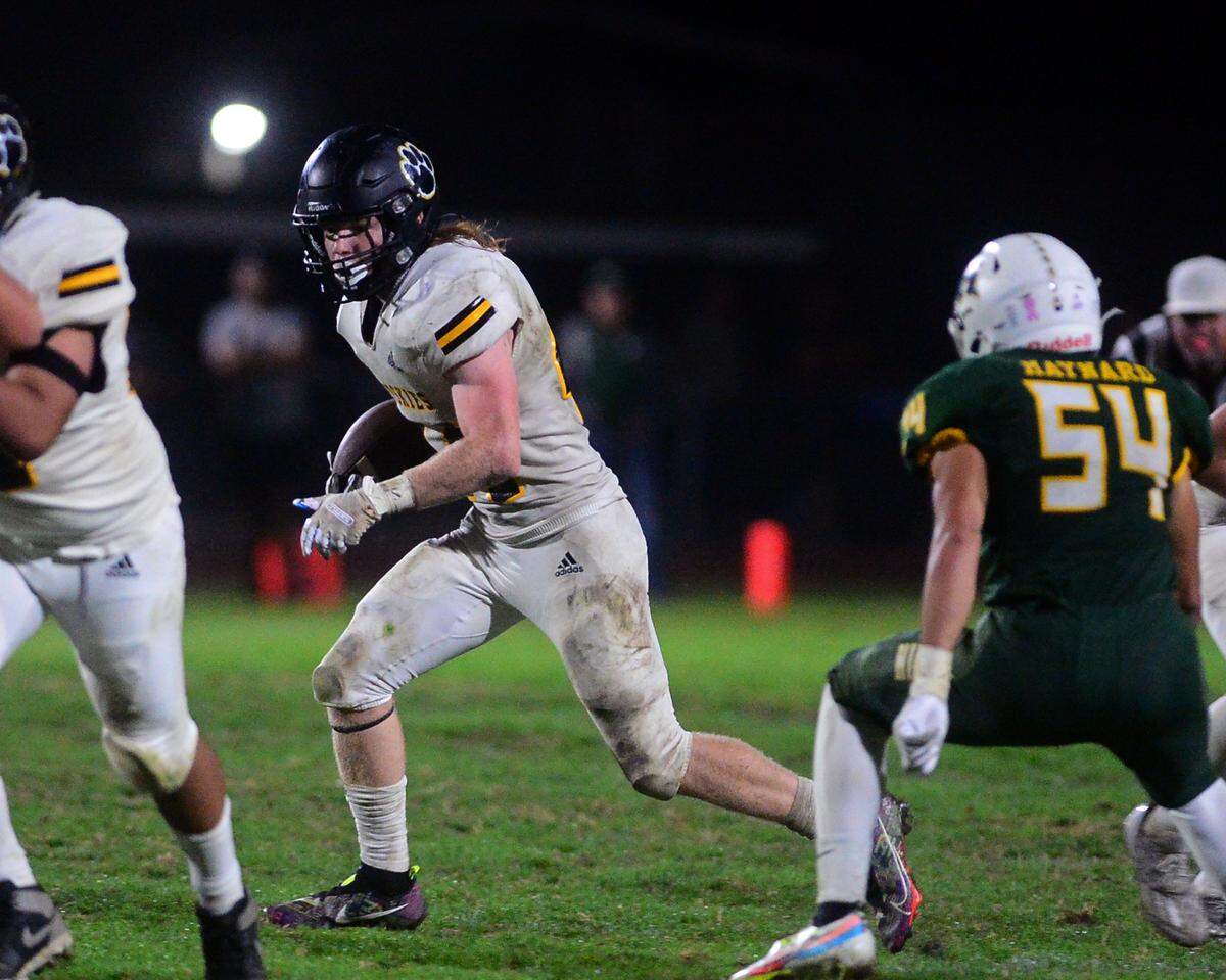 Hughson running back Liam Bridgford (44) looks for an opening during a game between Hughson High School and Hilmar High School in Hughson, CA, on Oct. 14, 2022.