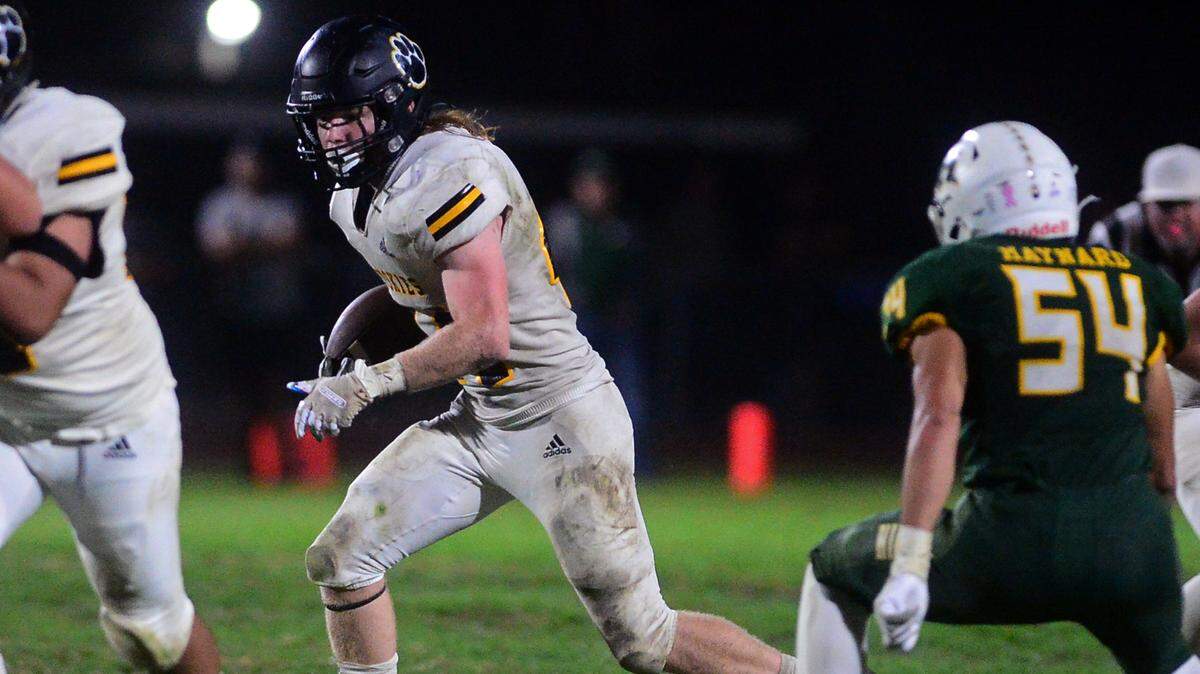 Hughson running back Liam Bridgford (44) looks for a opening during a game between Hughson High School and Hilmar High School in Hughson CA on October 14, 2022.
