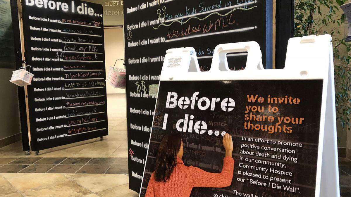 This file photo shows part of a nine-panel “Before I Die” wall created by Community Hospice to promote conversations about end-of-life decision-making.