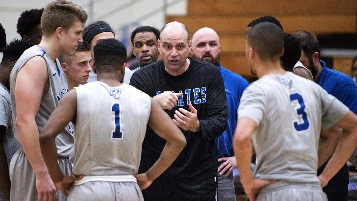 Modesto coach Mike Girardi talks with his team during a timeout during the game with Columbia at Modesto Junior College in Modesto, Calif., on Saturday, Dec. 16, 2017. Columbia won the game 72-71.