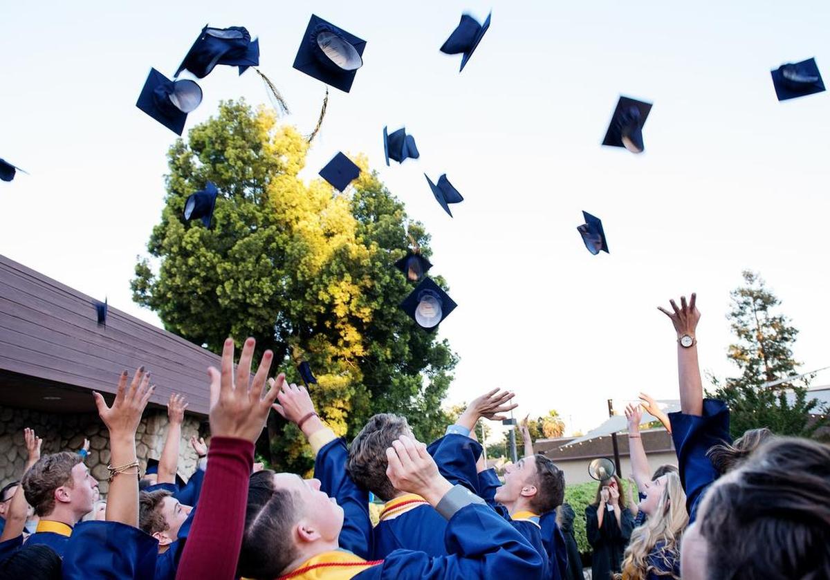Big Valley Christian School seniors toss their caps after a graduation ceremony at Big Valley Grace Community Church in Modesto, Calif., Friday, June 1, 2018.