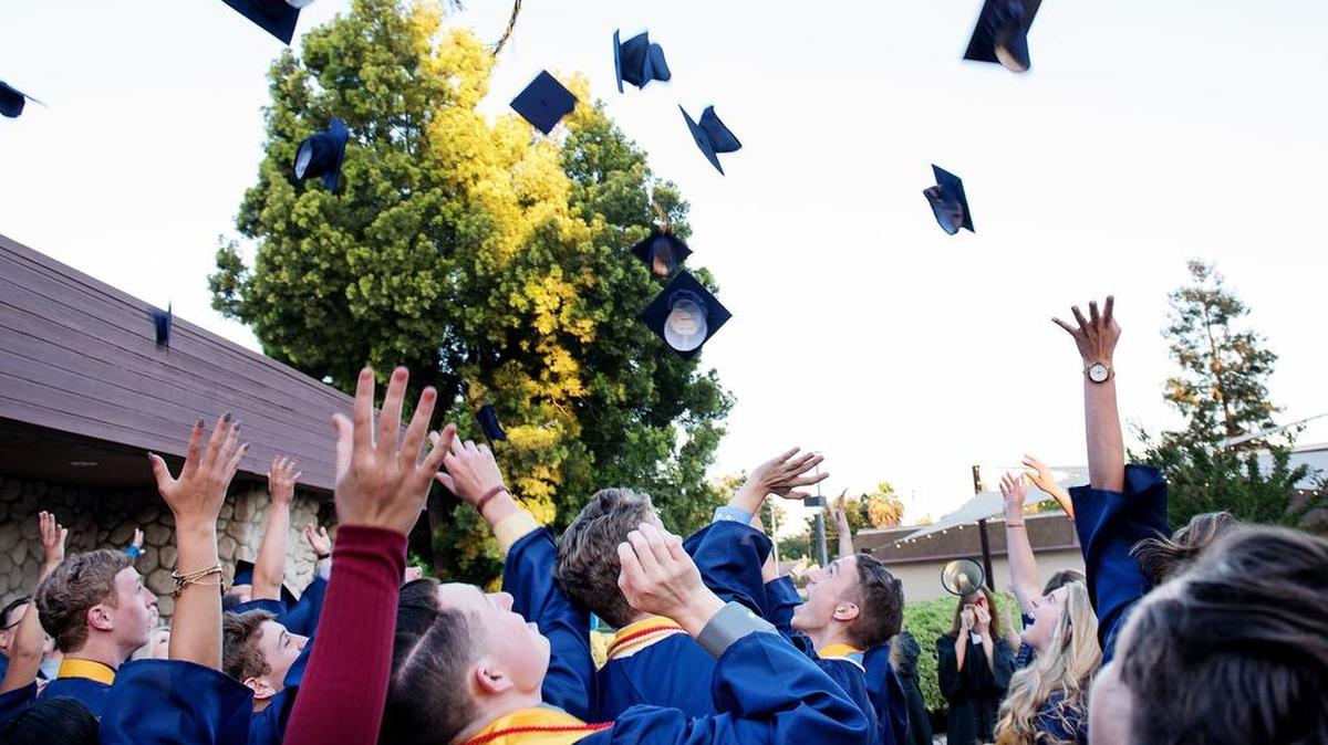 Big Valley Christian School seniors toss their caps after a graduation ceremony at Big Valley Grace Community Church in Modesto, Calif., Friday, June 1, 2018.
