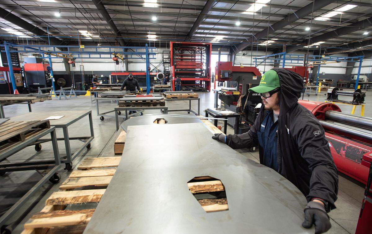 Fabricator Thimson Nguyen works with sheet metal at Flory Industries, which makes nut harvesting equipment in Salida, Calif., Thursday, Feb. 9, 2023.
