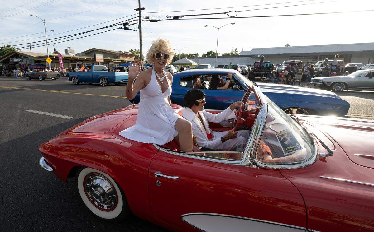 Classic cars cruise McHenry Avenue during the Graffiti Parade in Modesto, Calif., Friday, June 9, 2023.