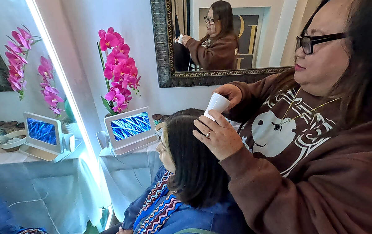 Marife Ronquillo analyzes the scalp of Maria Figueroa and before a Korean head spa at K Glow Day Spa in Modesto, Tuesday, Feb. 25, 2026.