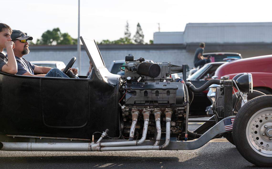 Classic car owners cruise down McHenry Avenue during the Graffiti Parade in Modesto, Calif., Friday, June 9, 2023.