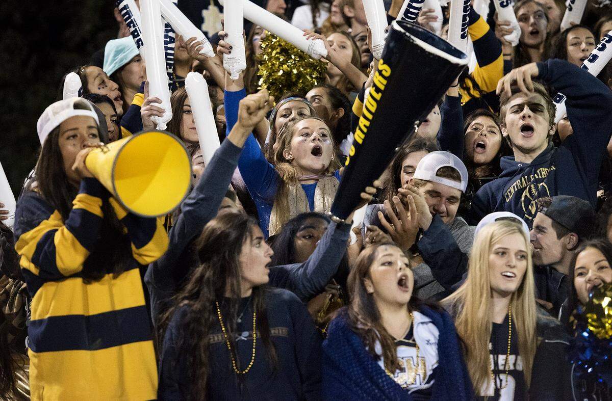Central Catholic students cheer on their team at Central Catholic High School in Modesto, Calif., on Friday, Nov. 6, 2015.