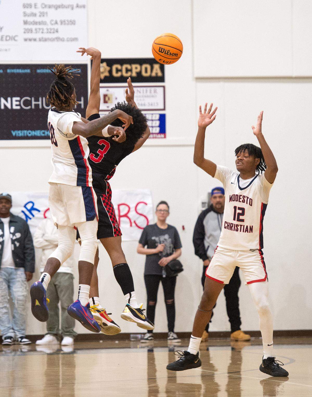 Modesto Christian’s BJ Davis blocks the shot of Lincoln’s Elijah Holmes during the Sac-Joaquin Section Division I playoff game at Modesto Christian High School in Salida, Calif., Friday, Feb. 17, 2023.