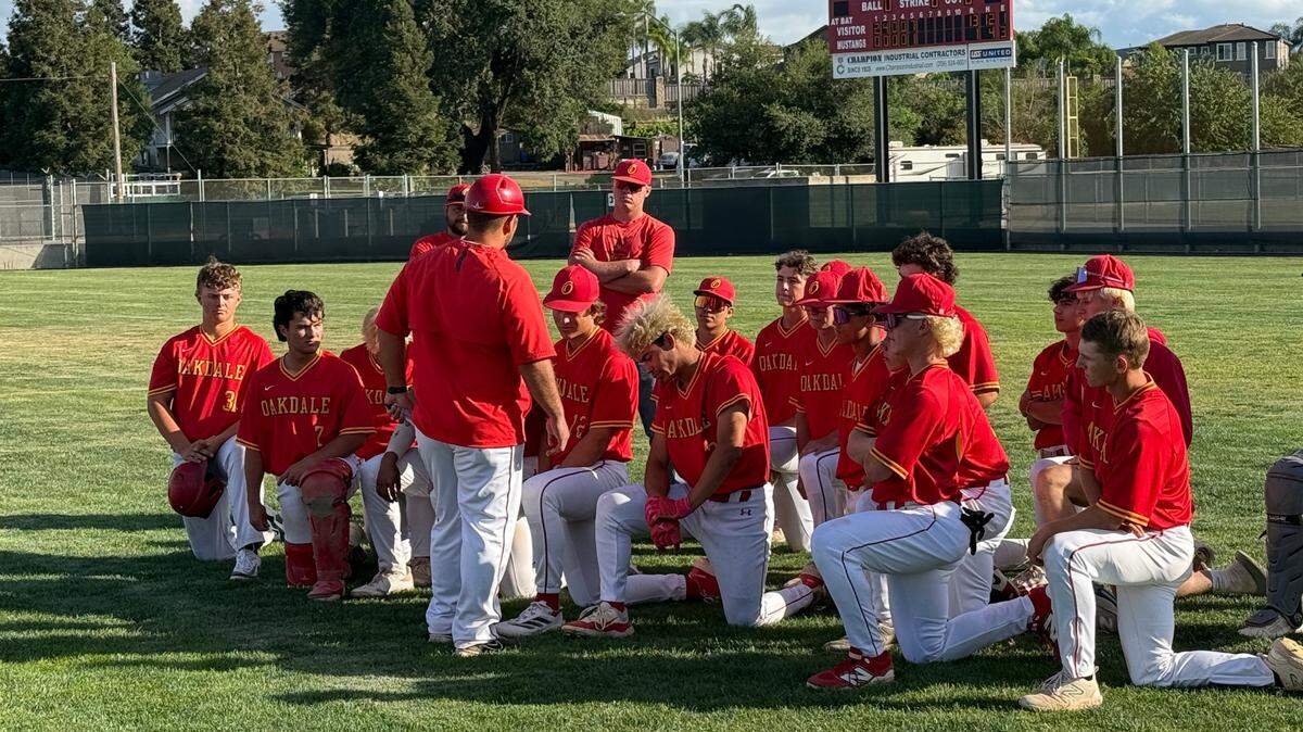 Oakdale baseball head coach Joey Machado talks to the team after Game 1 of the 2025 CIF Sac-Joaquin Section Division VI semifinals series against Roseville.