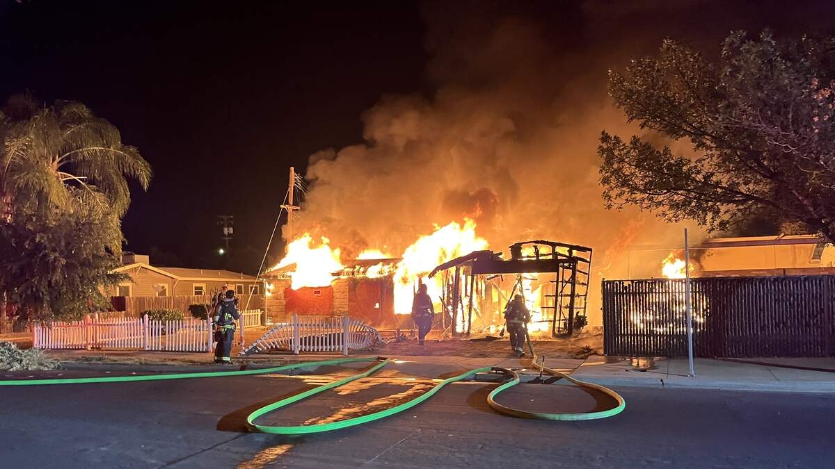 Firefighters contained a structure fire that displaced residents early Monday morning.