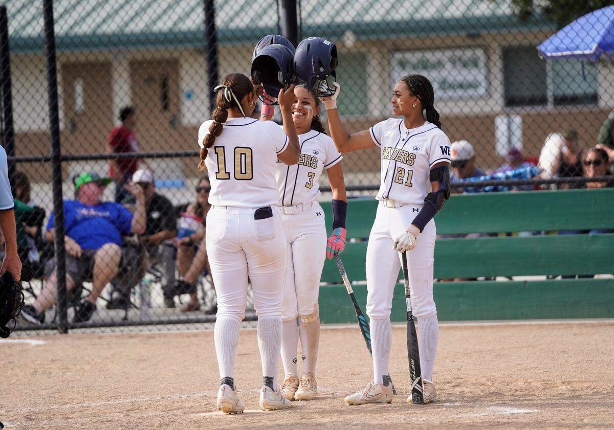Central Catholic’s Madie Harrison is greeted by teammates Jazmarie Roberts and Ceriah Fitzhugh after her second home run during a Valley Oak League game against Manteca at Manteca High School on Tuesday, April 22, 2025.