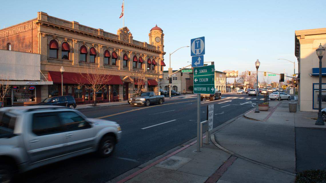 Motorists on Highway 108 pass through downtown Oakdale, Calif., Friday, Dec. 18, 2020.