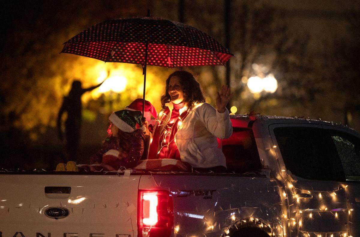 Modesto Mayor Sue Zwhalen waves to the crown on I Street during the Celebration of Lights holiday parade in Modesto, Calif., Saturday, Dec. 3, 2022.