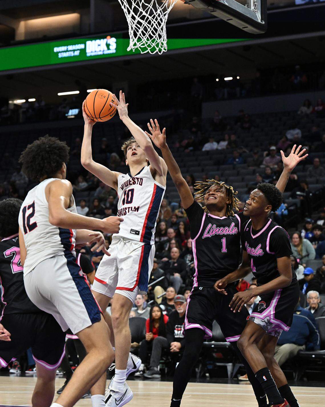 Modesto Christian’s Ry Atkins scores in the paint during the Sac-Joaquin Section Division I championship game with Lincoln of Stockton at the Golden 1 Center in Sacramento, Calif., Wednesday, Feb. 21, 2024.