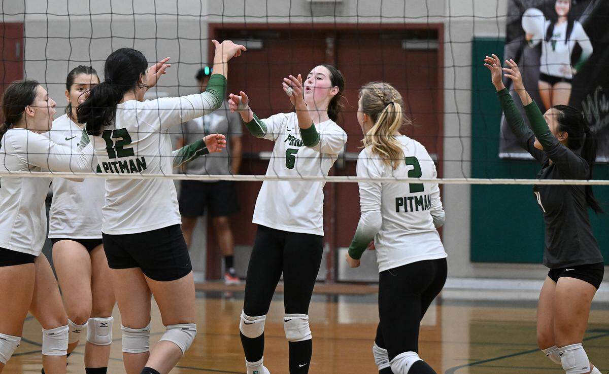 Pitman players celebrate a point during the non-league match at Pitman High School in Turlock, Calif., Thursday, September 7, 2023. Oak Ridge won the match 3-2.